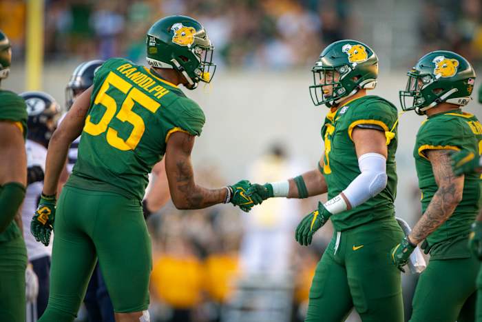 Oct 16, 2021; Waco, Texas, USA; Baylor Bears linebacker Dillon Doyle (5) and linebacker Garmon Randolph (55) celebrates Doyle making a sack against the Brigham Young Cougars during the second half at McLane Stadium.